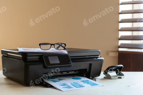 Preview: Front view of a black printer machine on a table