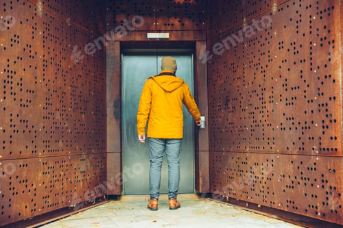 Preview: Single Elevator Door Outside Rusty Exterior Man Wiaitng For Elevator