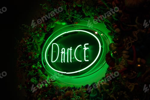 Preview: Green neon dance sign against dark background