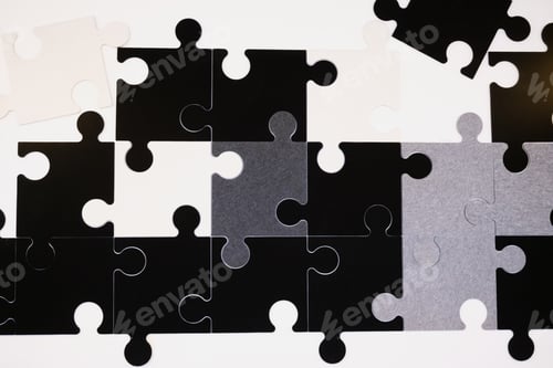 Preview: Black and white pieces of a puzzle, hanging on the wall, decorative.