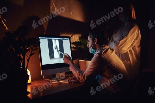 Preview: Two docters are working in the dark office