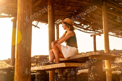 Preview: Tourist woman at sunset on Tacoron beach on El Hierro, Canary Islands