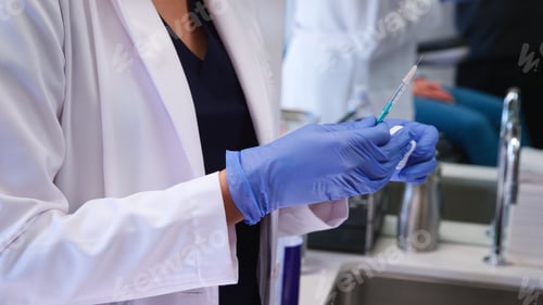 Preview: Close Up Of Beautician Or Doctor Holding Syringe Before Giving Patient Botox Injection