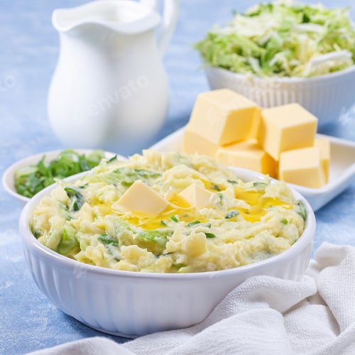 Preview: Delicious homemade Irish dish Colcannon or mashed potato with green cabbage and butter, square