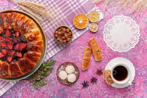 Preview: top view yummy strawberry pie fruity cake with tea on pink background tea sweet pie cookies sugar