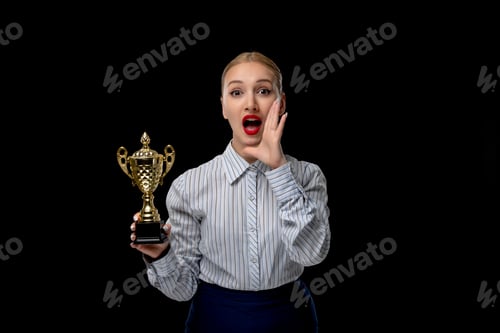 Preview: Business woman blonde panicking girl holding a trophy with red lipstick in office outfit