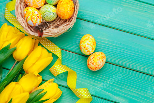 Preview: Beautiful Easter composition with decorated eggs and flowers on pastel wooden background