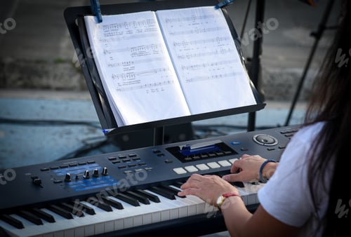 Preview: Woman musician playing melodies on a piano outdoors. Street music artist