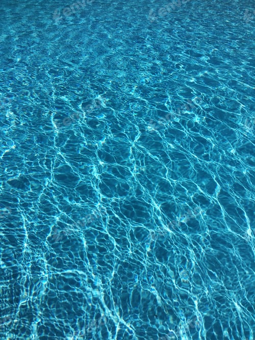 Preview: Clear blue water in the pool in summer, texture and background