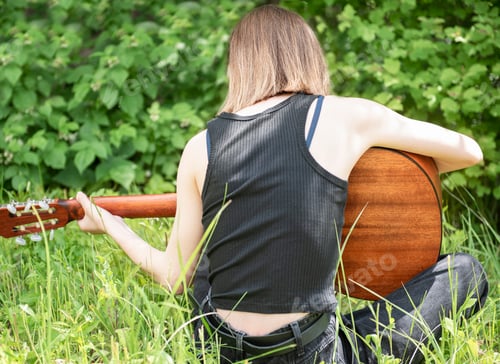 Preview: Teenager Girl Playing Guitar