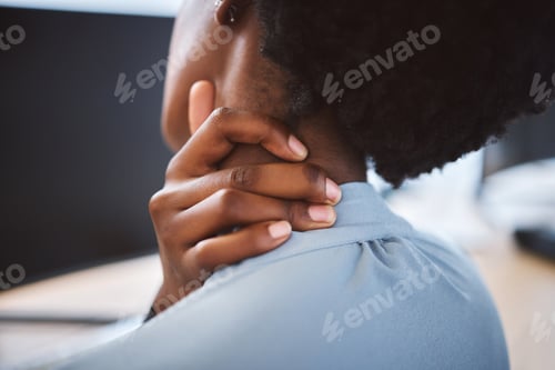 Preview: Closeup of one stressed african american businesswoman suffering with neck pain in an office. Entre