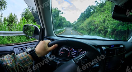 Preview: People driving car on morning mountain road