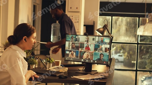 Preview: Employee attending online conference meeting on webcam