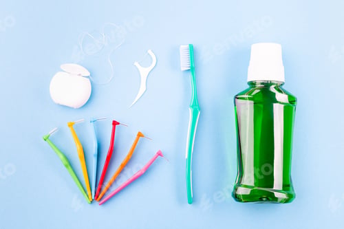 Preview: Dental floss, toothbrush, interdental brush angles and mouthwash on blue