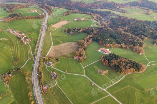 Preview: Aerial view of small scattered farm houses with red tiled roofs