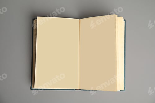 Preview: Open book on light grey background, top view. Space for text
