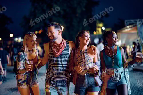 Preview: Friends Enjoying Drinks Together at Outdoor Night Event