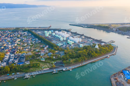 Preview: Petrochemical oil refinery and sea in industrial engineering, urban city. Oil and gas tanks