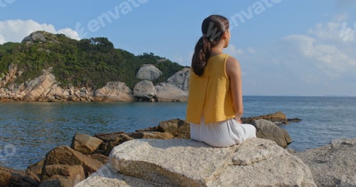 Preview: Woman enjoy the view of the sea at summer time