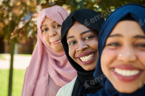 Preview: Three Smiling Women Wearing Headscarves Outdoors