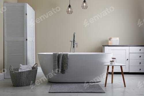 Preview: Soft grey mat on floor near tub in bathroom. Interior design