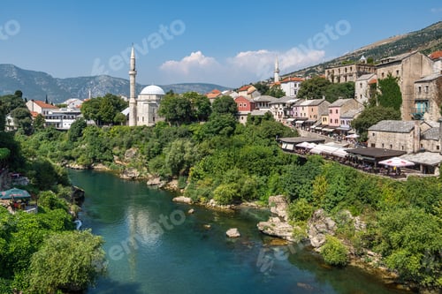 Preview: Neretva River Meandering Through a Lush Green Hillside in Mostar, Bosnia and Herzegovina