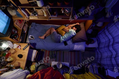 Preview: Woman sleeping on single bed at night