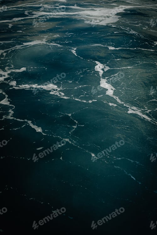 Preview: Detail on sea water with foam, background