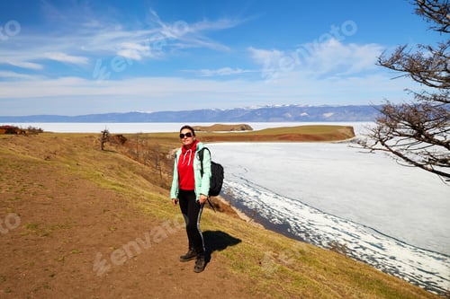 Preview: Lake Baikal in spring. The time of ice melting on the lake. A woman traveling alone on Olkhon Island