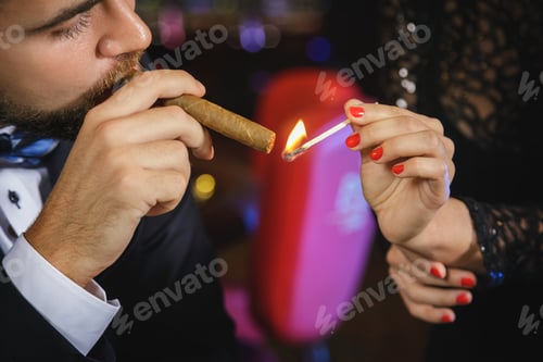 Preview: Portrait of handsome young man with a cigar