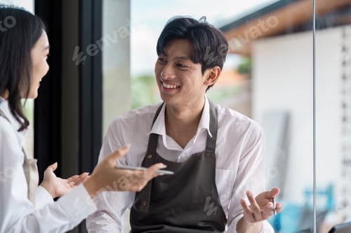 Preview: Young Professionals Engaged in a Productive Business Meeting in a Modern Office Setting with Natural