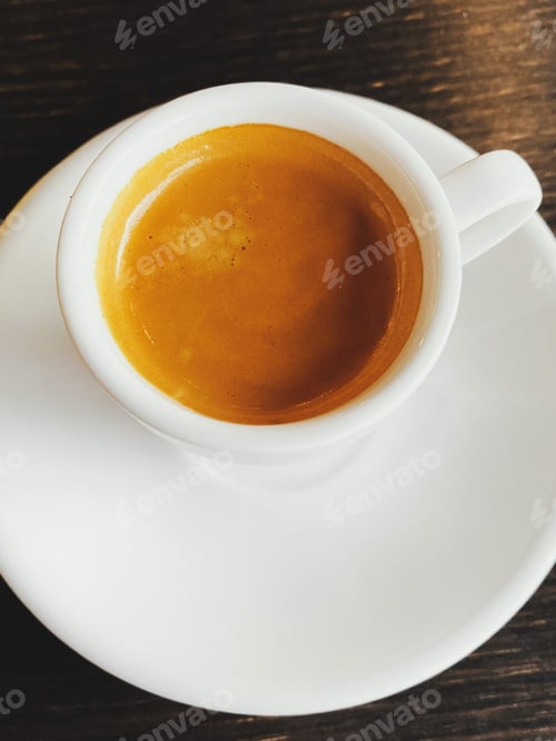 Preview: Fresh italian espresso in cup on table