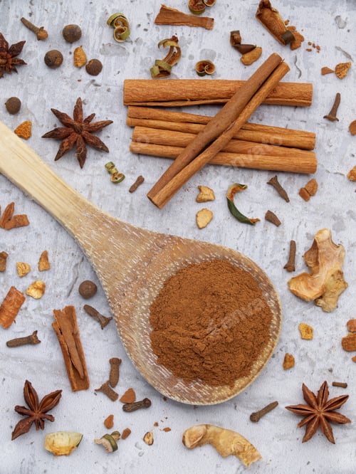 Preview: Flatlay of assorted spices including cinnamon.