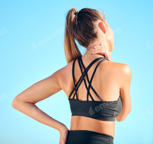 Preview: Rearview beautiful woman practising yoga exercise on the beach. Young female athlete suffering with