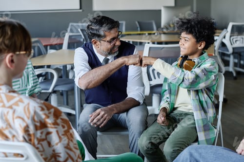 Preview: Teacher And Student Doing Fist Bump