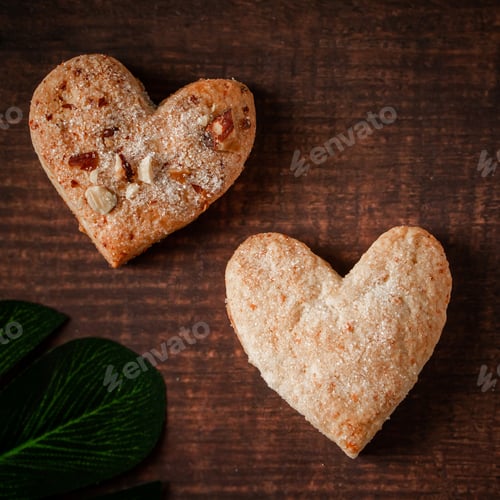 Preview: Heart shaped cookies on brown background