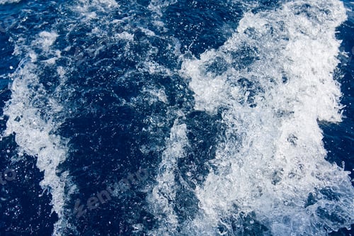 Preview: Abstract blue sea water with white waves. Blue sea texture with waves and foam. Mediterranean sea