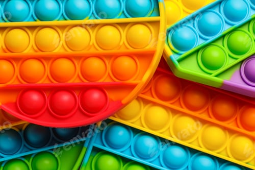 Preview: Rainbow pop it fidget toys as background, closeup