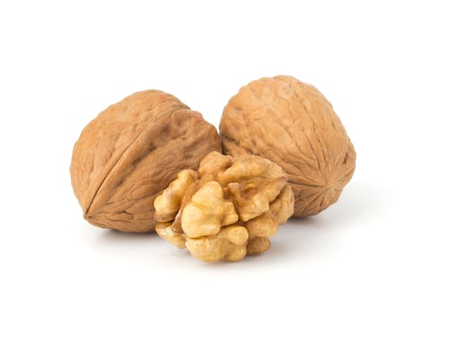 Preview: Whole and cracked walnut isolated on the white background