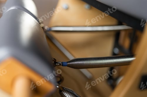 Preview: Pilates equipment. Springs close up. Reformer bed. Reformer pilates studio machine for fitness