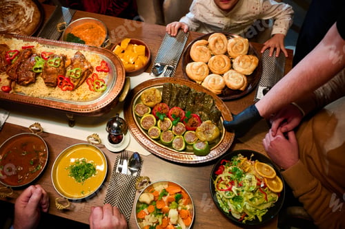 Preview: In this captivating aerial view, delicious food adorned with Ramadan decorations, including dates