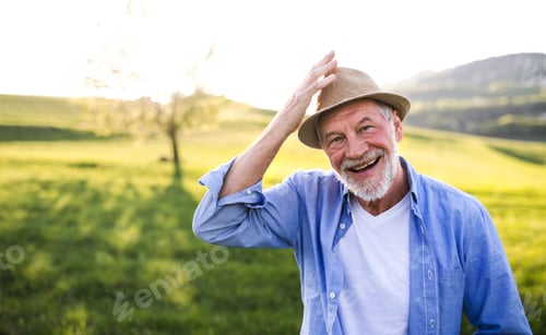 Preview: Portrait of a senior man in spring nature. Copy space.