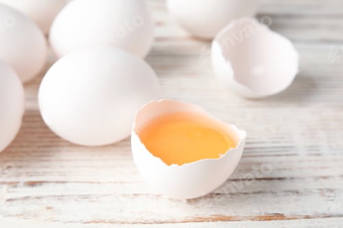 Preview: Few raw chicken eggs on wooden background