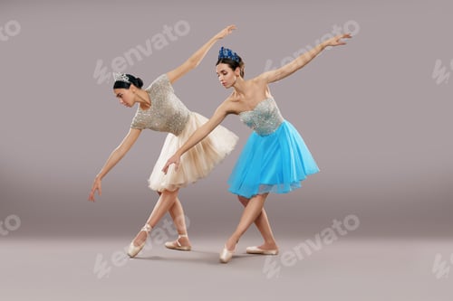 Preview: Side view of two dancers dancing and bending down in studio