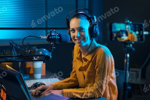 Preview: Smiling video blogger recording in the studio