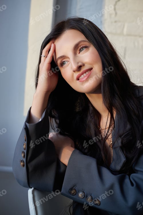 Preview: Elegant Woman in Gray Jacket Posing Indoors
