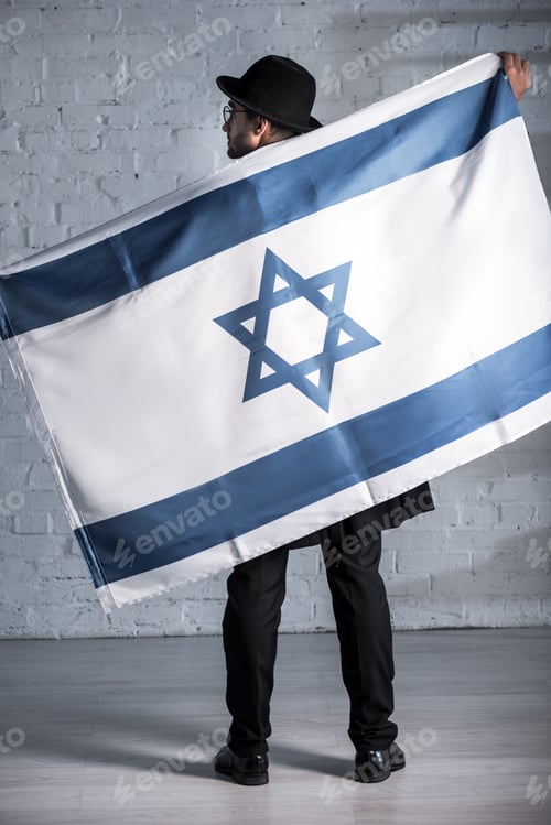 Preview: back view of jewish man with flag of israel
