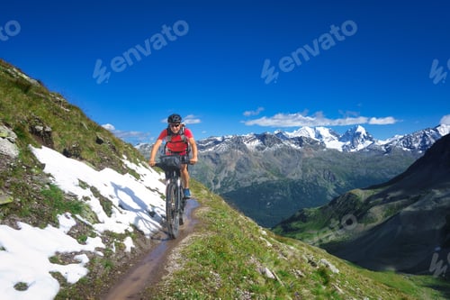 Preview: Biker on mountain trail