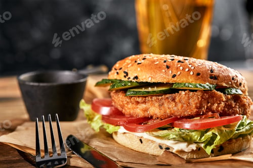 Preview: The concept of American fast food. A juicy American burger with two beef patties and a dark beer on