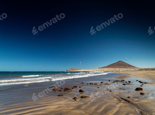Preview: el medano beach and montana roja landscape in tenerife spain